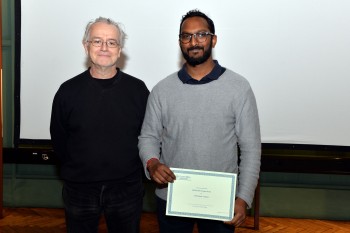 Caumaghen Sannassy (left) being congratulated on his award by Dr Adrian Briggs