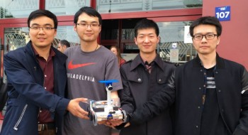 The team stand proudly with their robot. From L to R is
Xingchen Zhang, Siyuan Zhan, Chang He and Feifan Zhang.
