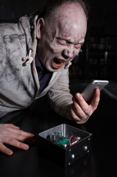 A zombie charging his phone using the energy harvesting technology. [David Parry/PA Wire]