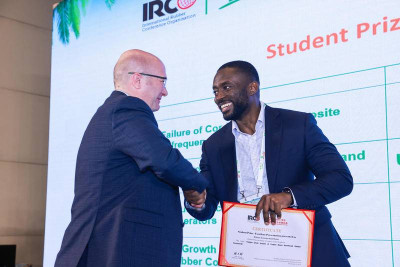 William being awarded the best student presentation award by Dr Matthew Thornton, the IRCO Secretary General