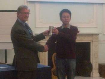Congwei receives his award of the tankard bearing his name